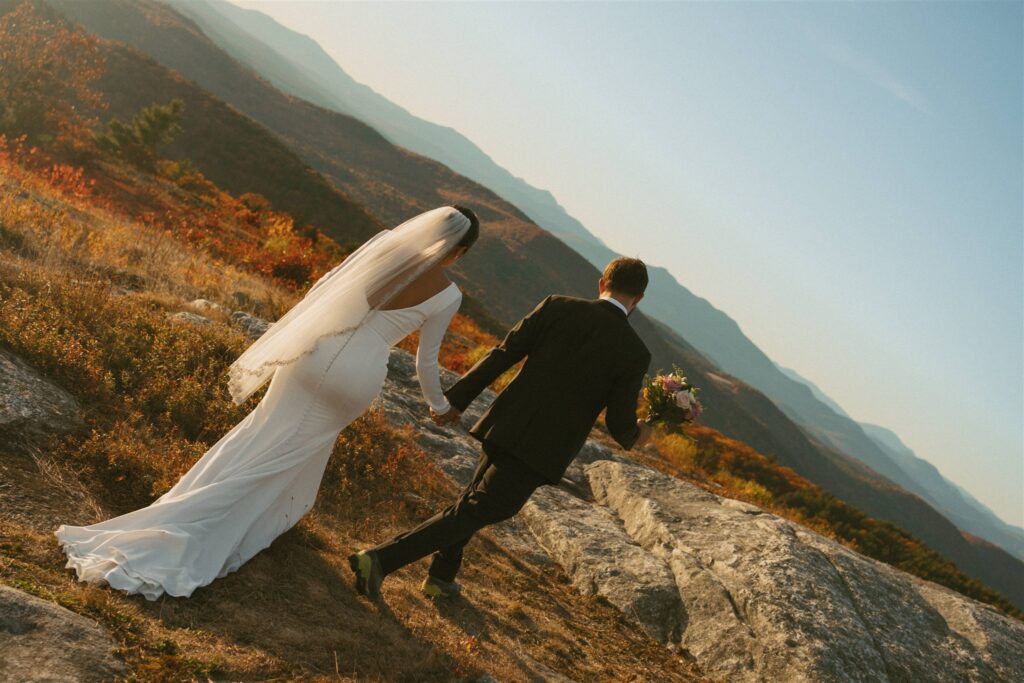 Bride and groom eloping on a mountaintop in the White Mountains of New Hampshire