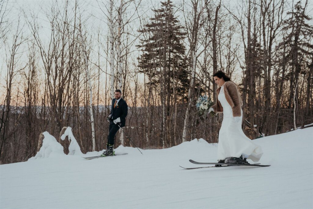 Couple skiing together during a winter elopement in New Hampshire